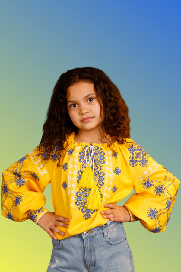 Girl's yellow blouse with blue embroidery